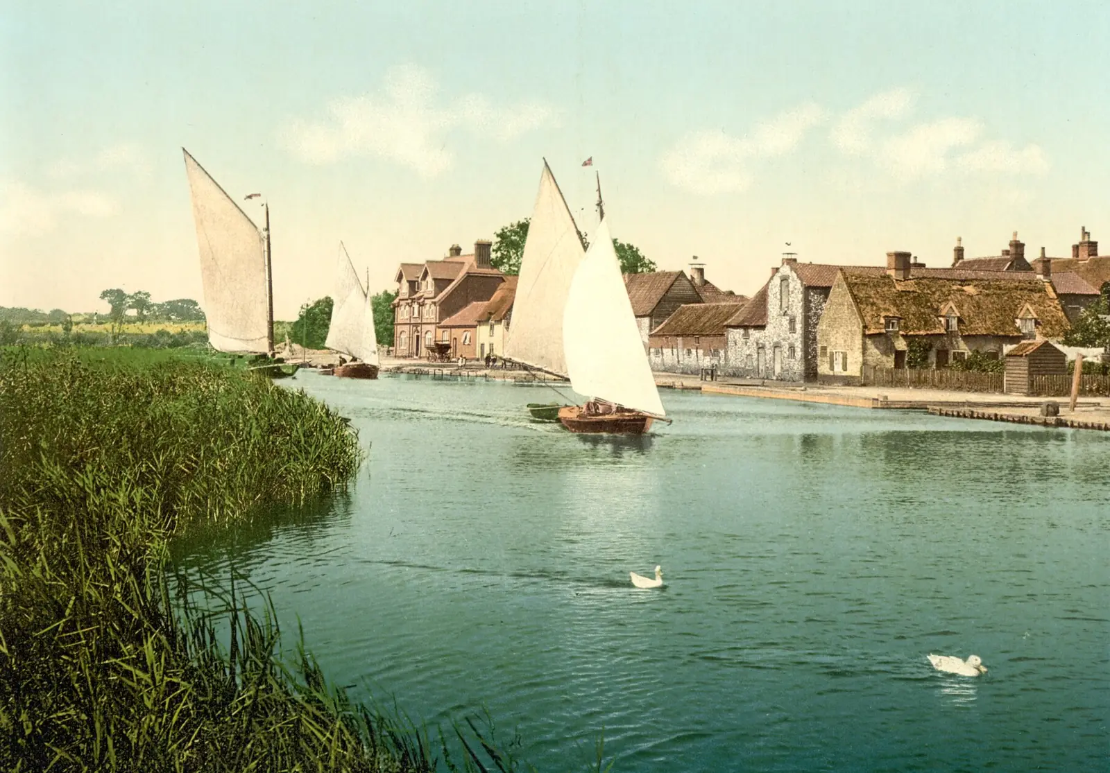 Horning village on the River Bure, Norfolk, around 1895, with sailing boats and cottages